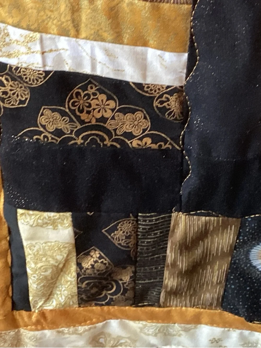 NWT. Gold and Black Star Lap Quilt